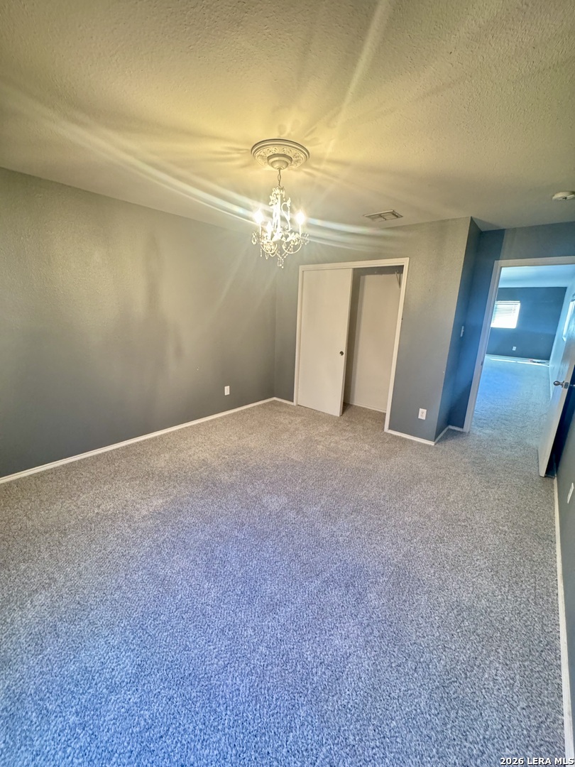 7906 Belmont Ridge Selma, TX 78154 - Photo 9 of 22 a view of a livingroom with a chandelier