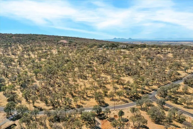 an aerial view of houses with yard