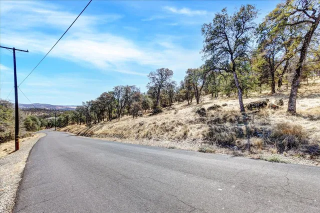 a view of a road with a building in the background