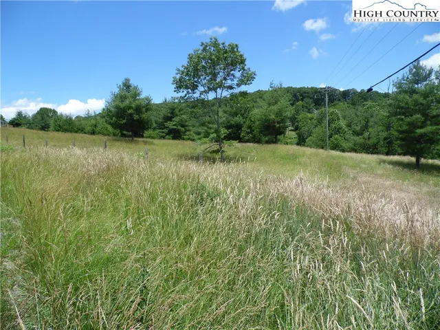 a view of outdoor space with deck and yard