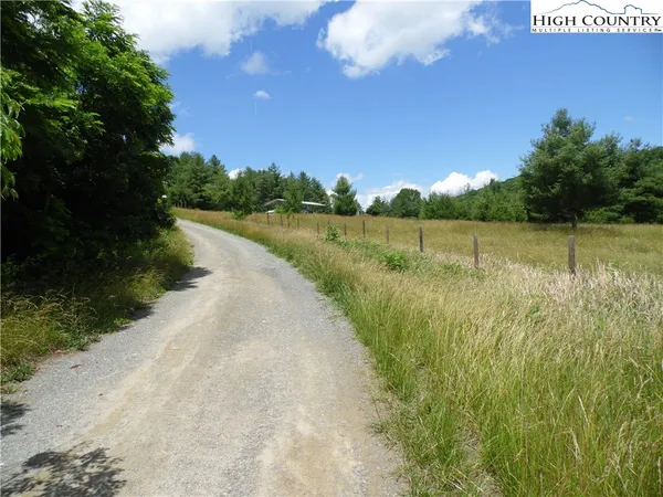 a view of a lake with houses in the back