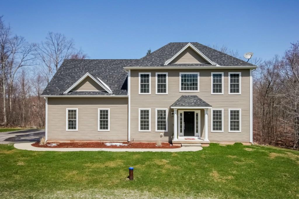 97 Meshomasic Trail Portland, CT 06480 - Photo 1 of 1 a front view of a house with a yard