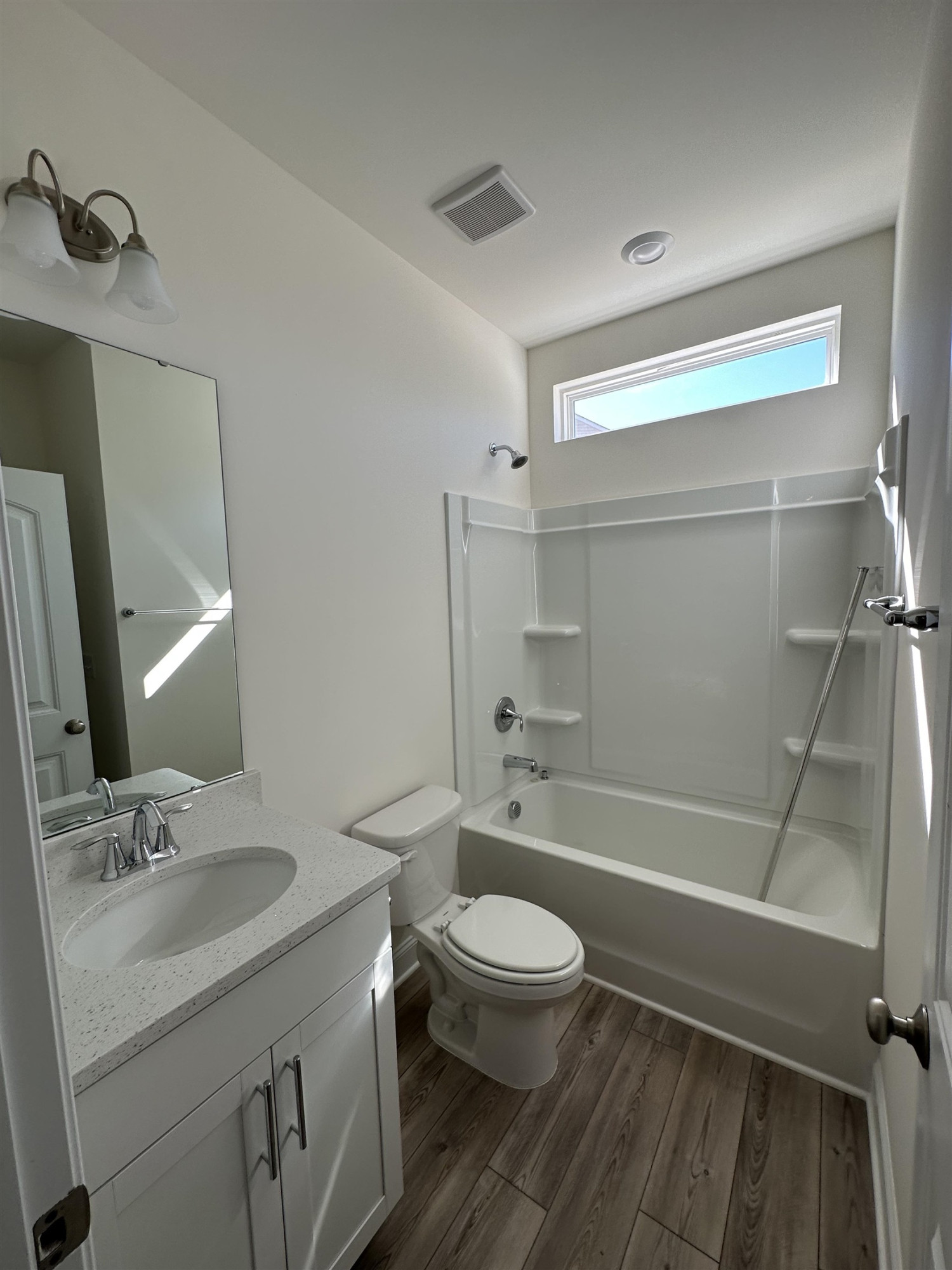 4304 Beckel Road Willow Spring, NC 27592 - Photo 13 of 28 a bathroom with a sink a toilet and shower