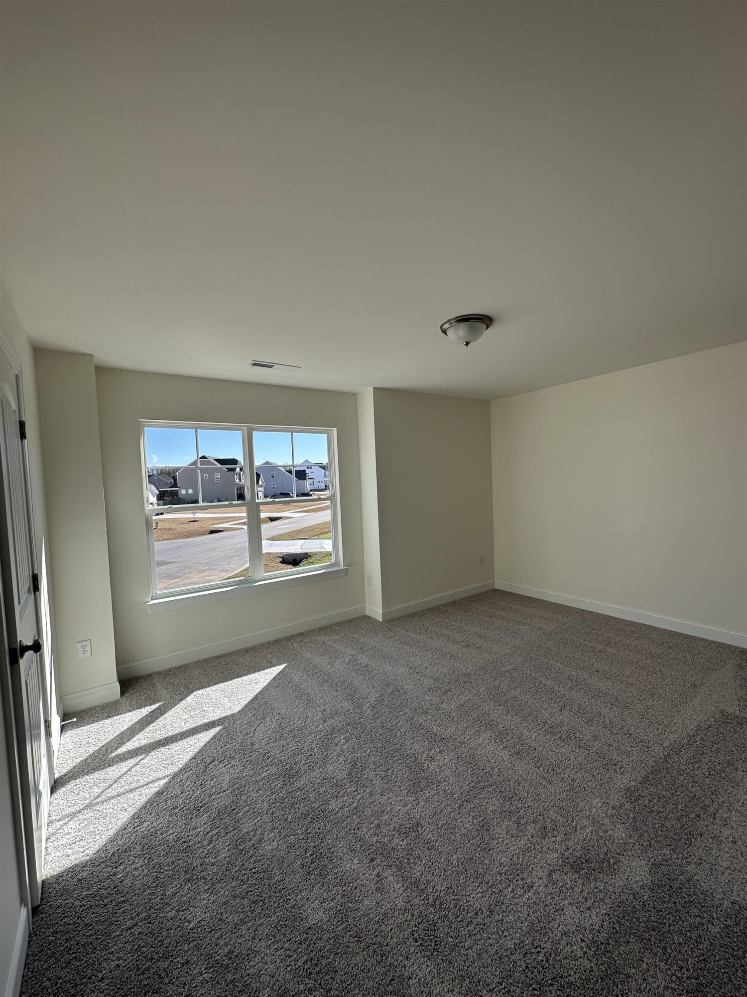 4304 Beckel Road Willow Spring, NC 27592 - Photo 19 of 28 a view of a room with window and furniture