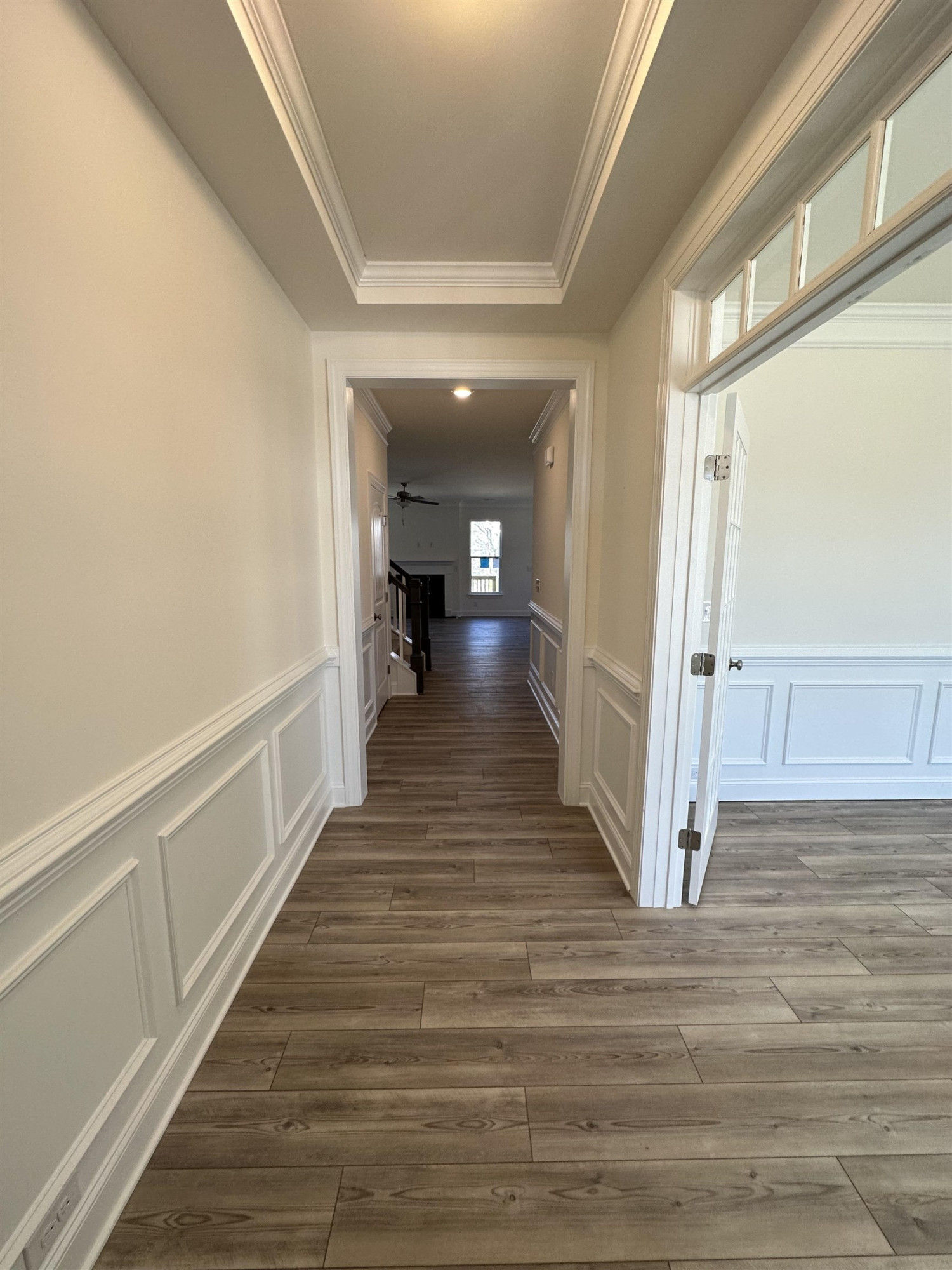 4304 Beckel Road Willow Spring, NC 27592 - Photo 2 of 28 a view of a hallway with wooden floor and staircase