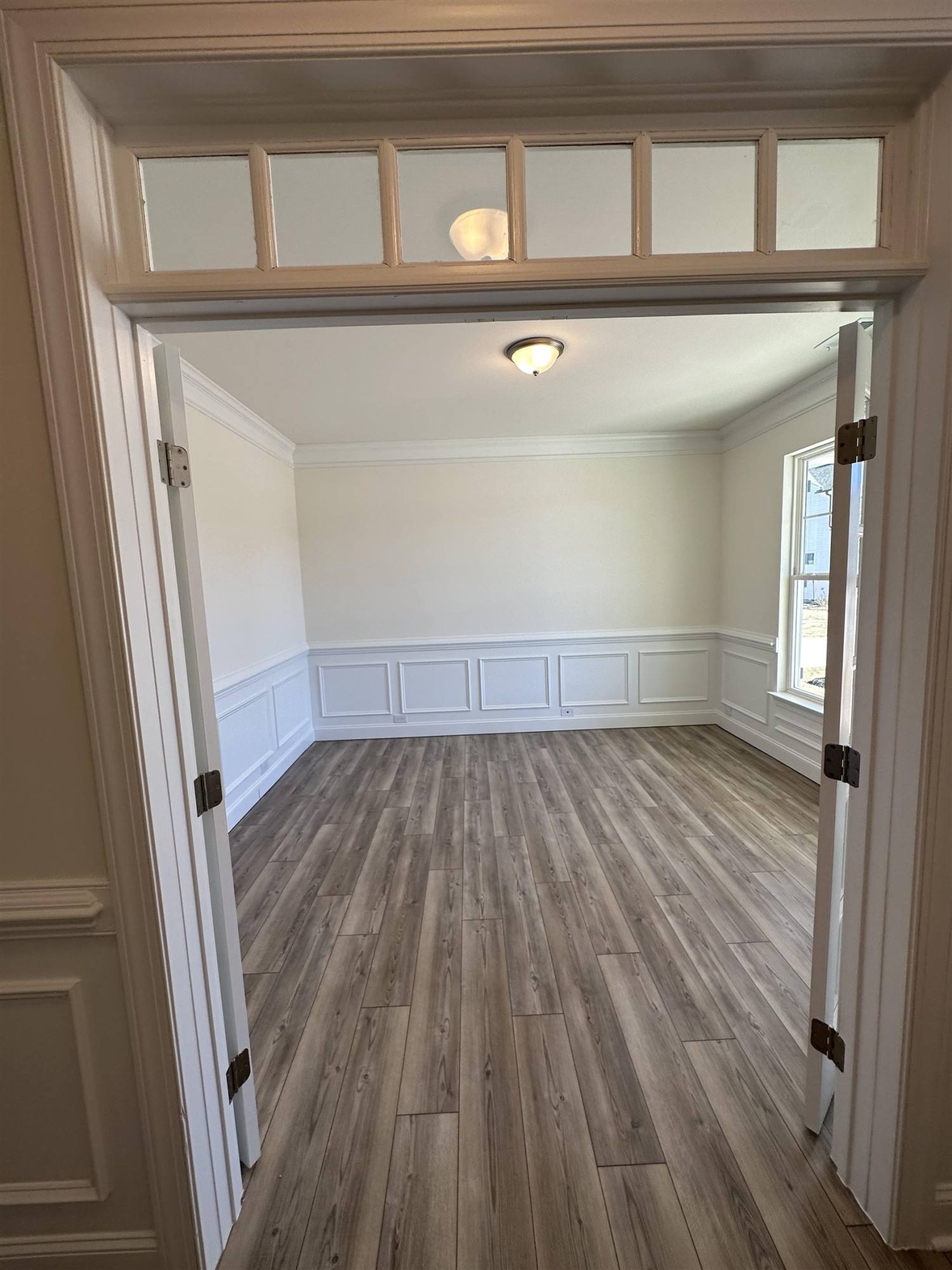 4304 Beckel Road Willow Spring, NC 27592 - Photo 3 of 28 a view of empty room with wooden floor and fan