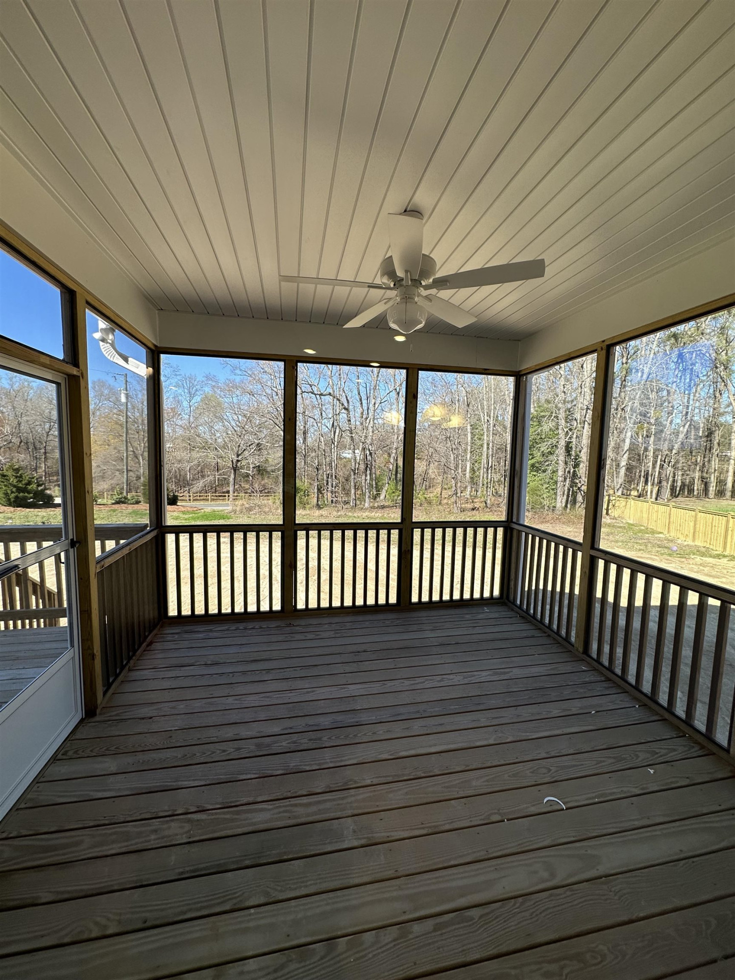 4304 Beckel Road Willow Spring, NC 27592 - Photo 9 of 28 a view of a porch with wooden floor