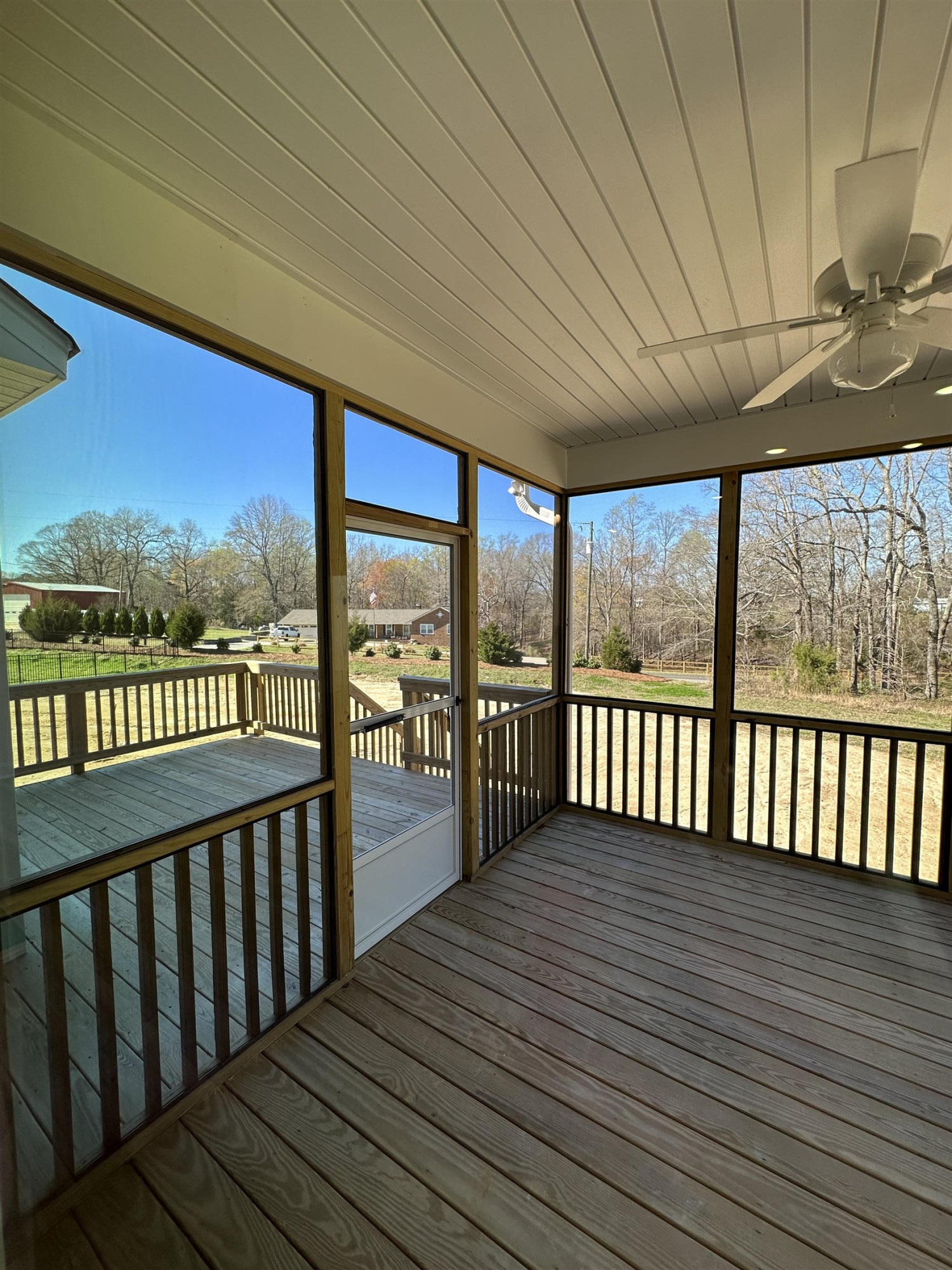 4304 Beckel Road Willow Spring, NC 27592 - Photo 10 of 28 a balcony with wooden floor and outdoor space
