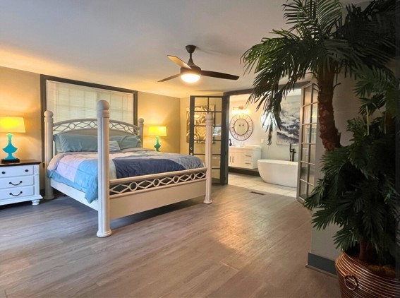 2524 Stinson Road Nashville, TN 37214 - Photo 7 of 23 a spacious bedroom with a large bed and a potted plant