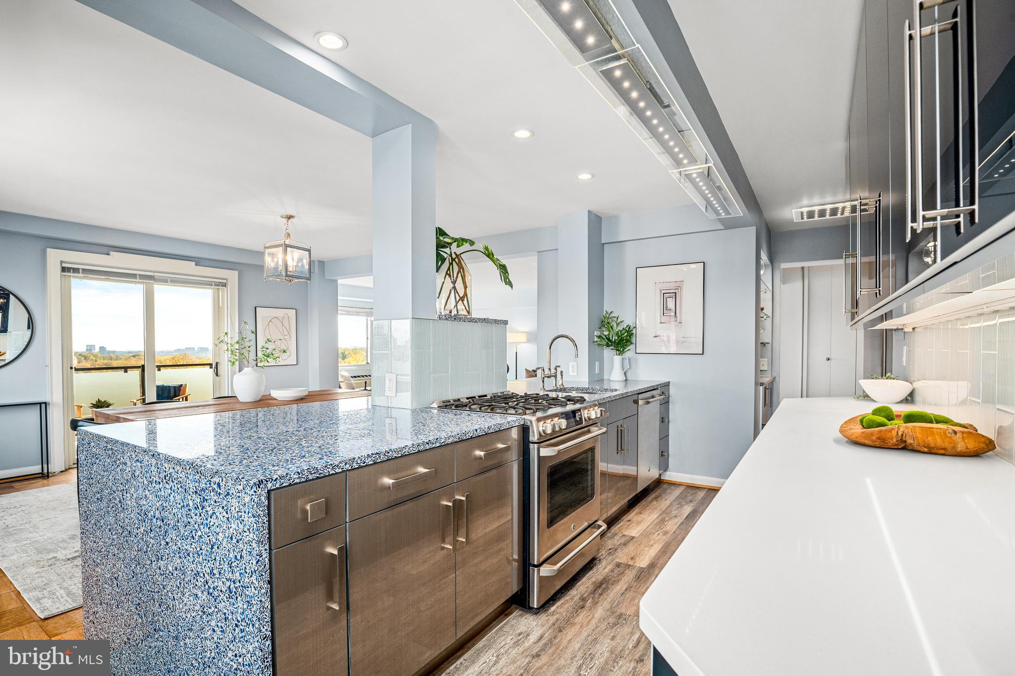 4201 Cathedral Avenue Northwest, Unit 1415W Washington, DC 20016 - Photo 11 of 36 a kitchen with stainless steel appliances granite countertop a stove and a sink