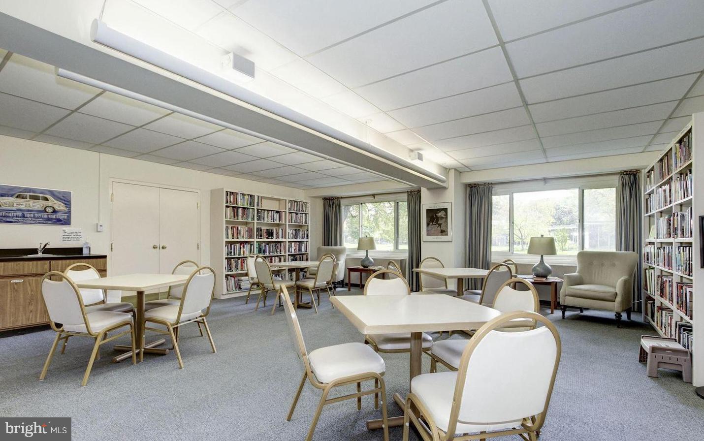 4201 Cathedral Avenue Northwest, Unit 1415W Washington, DC 20016 - Photo 35 of 36 a view of a dining room with furniture window and outside view