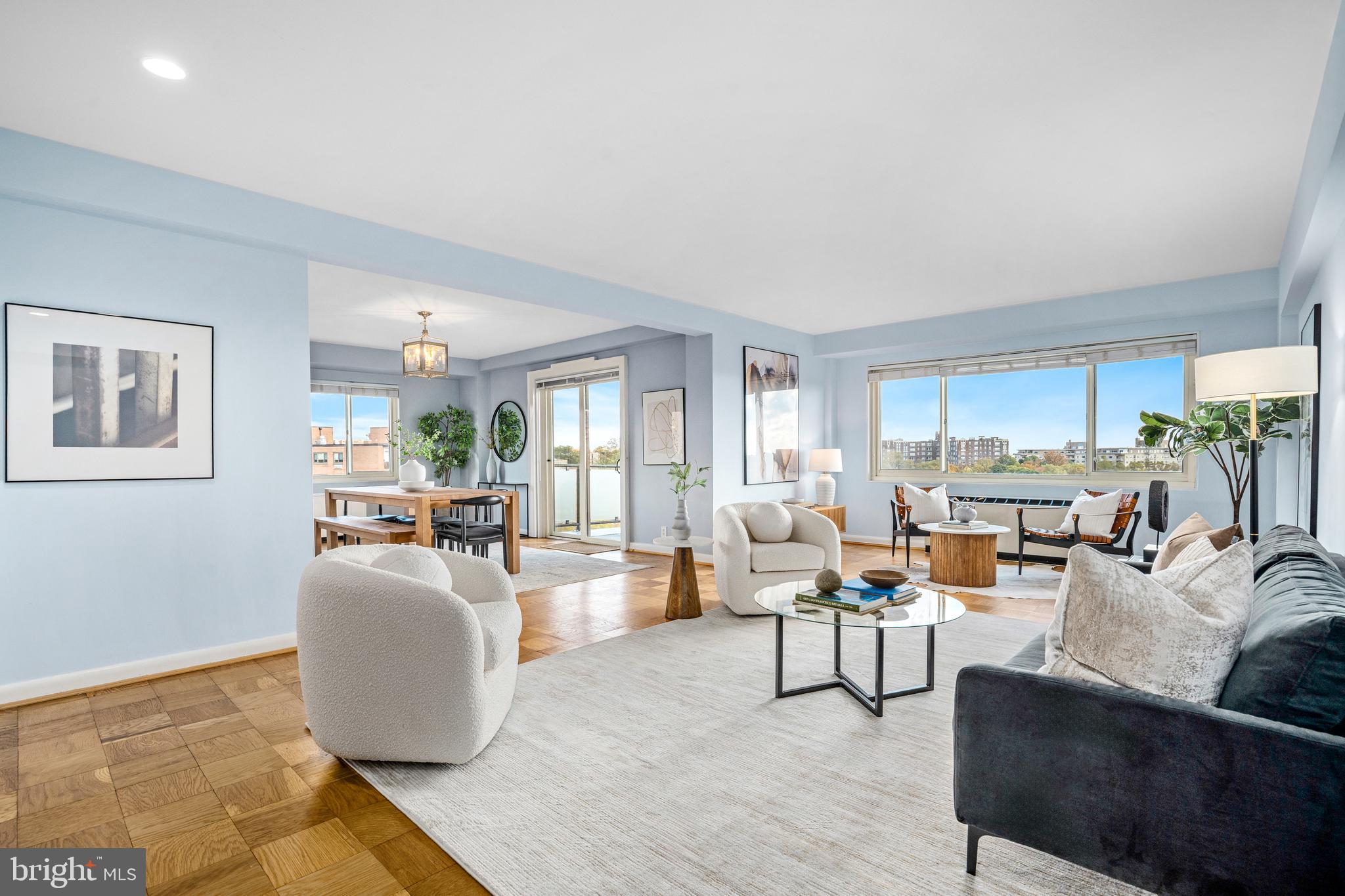 4201 Cathedral Avenue Northwest, Unit 1415W Washington, DC 20016 - Photo 4 of 36 a living room with fireplace furniture and a rug