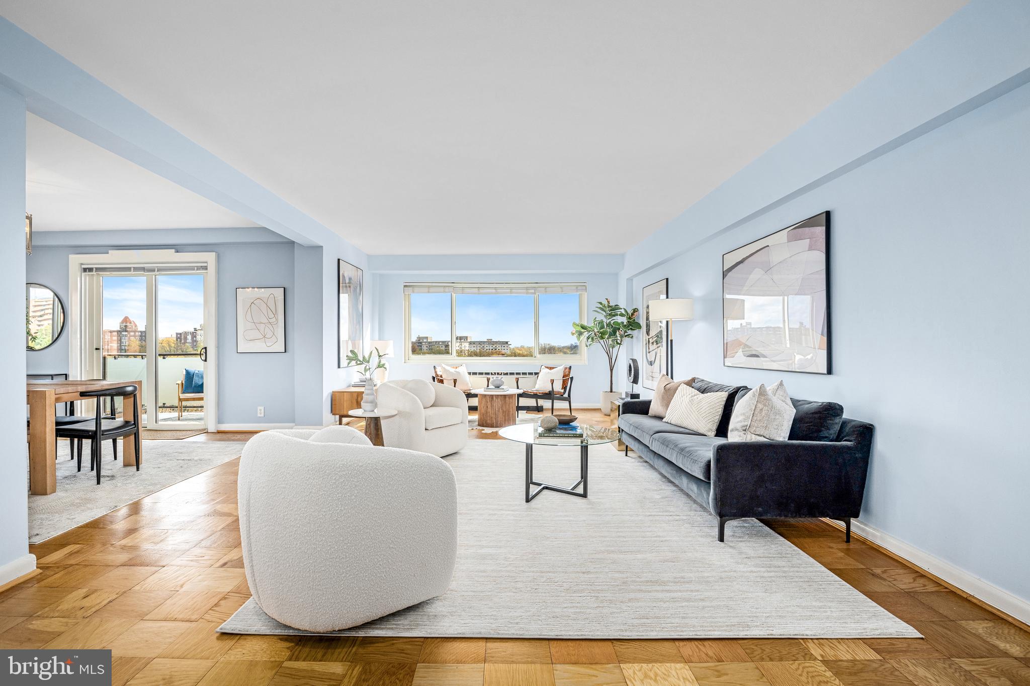 4201 Cathedral Avenue Northwest, Unit 1415W Washington, DC 20016 - Photo 5 of 36 a living room with fireplace furniture and a window