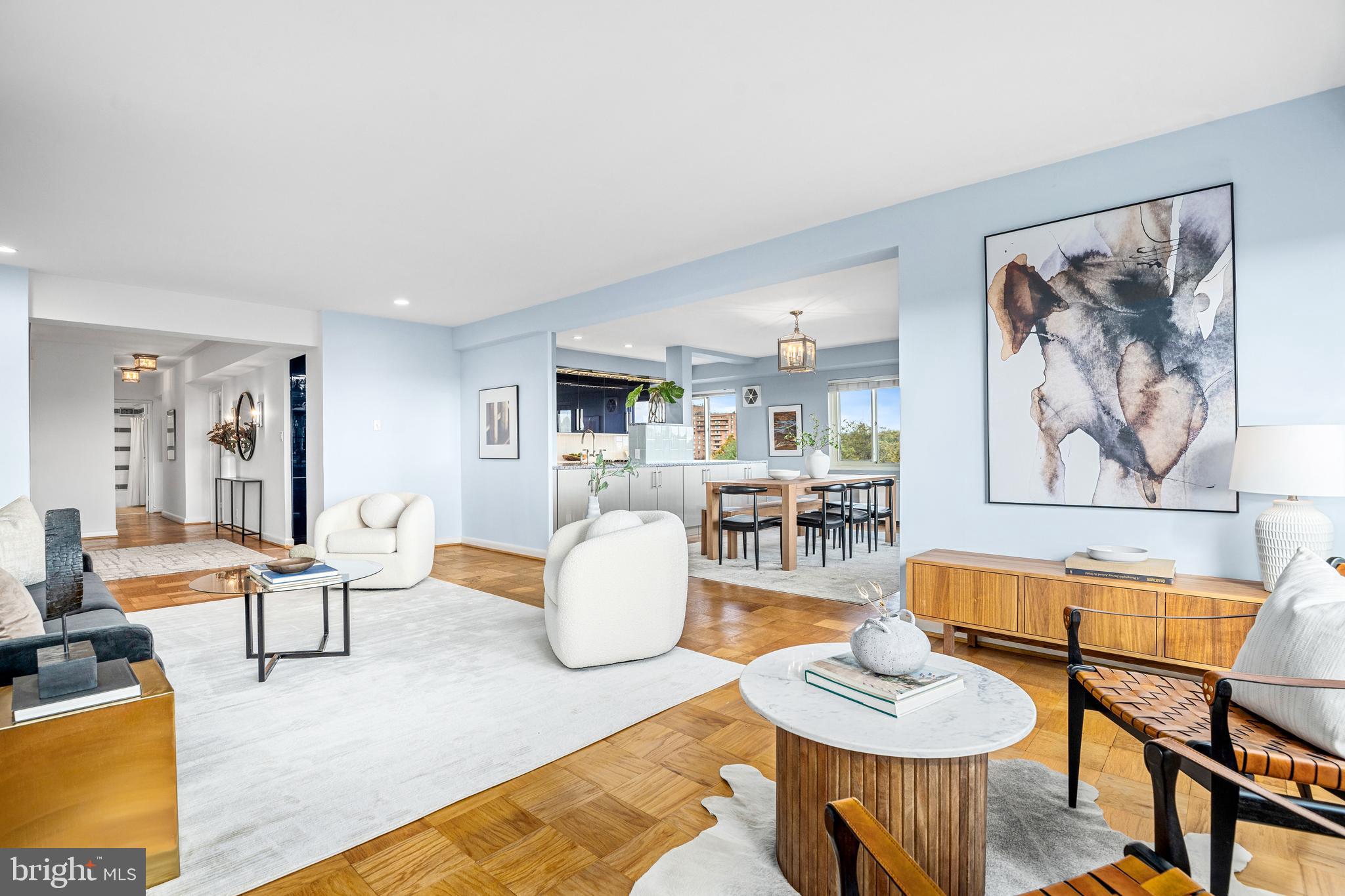 4201 Cathedral Avenue Northwest, Unit 1415W Washington, DC 20016 - Photo 7 of 36 a living room with furniture and a wooden floor