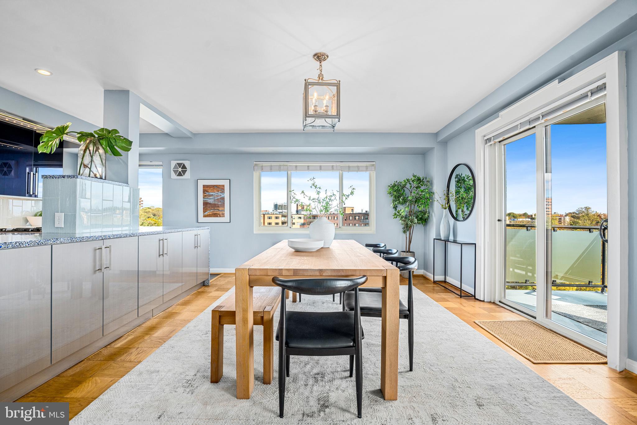 4201 Cathedral Avenue Northwest, Unit 1415W Washington, DC 20016 - Photo 8 of 36 a view of a dining room with furniture window and wooden floor