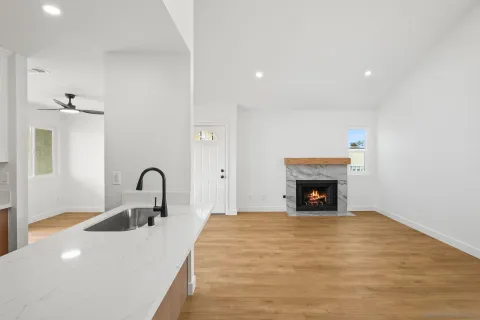 a spacious bedroom with a bed and a fireplace