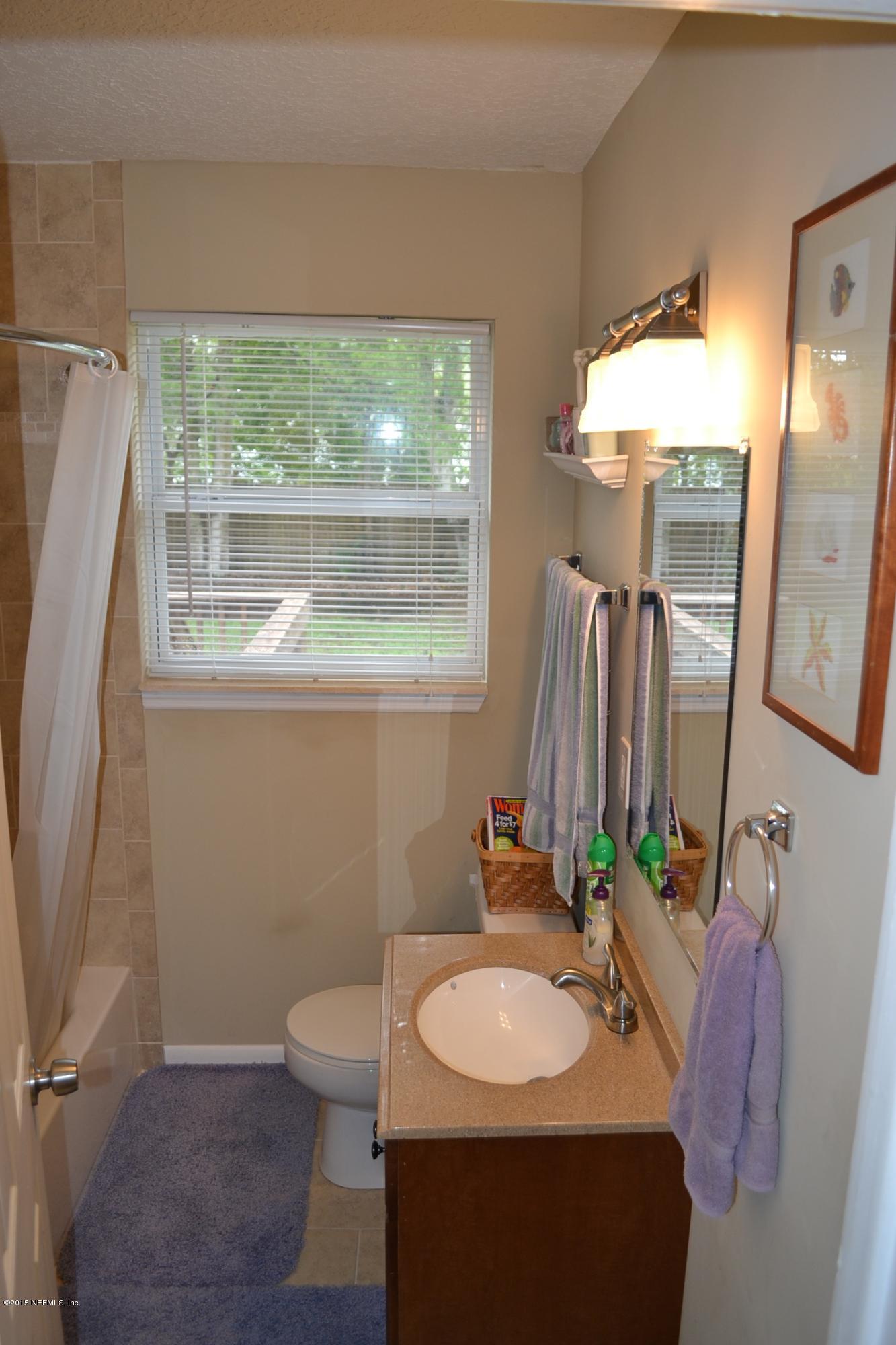 6720 E Road Jacksonville, FL 32216 - Photo 10 of 16 a bathroom with a sink toilet and mirror