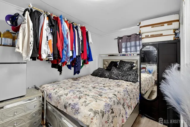 a bedroom with a bed and a closet