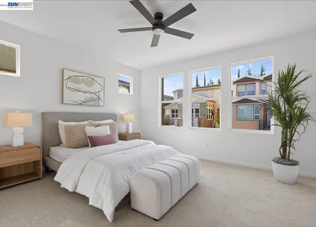 a bed room with a bed and a window