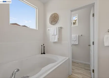 a bathroom with a sink double vanity granite and a mirror