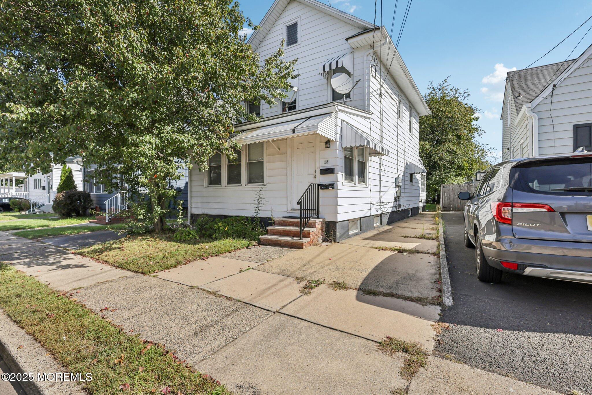 16 Reimer Street Raritan, NJ 08869 - Photo 1 of 30 a view of a white house and a yard
