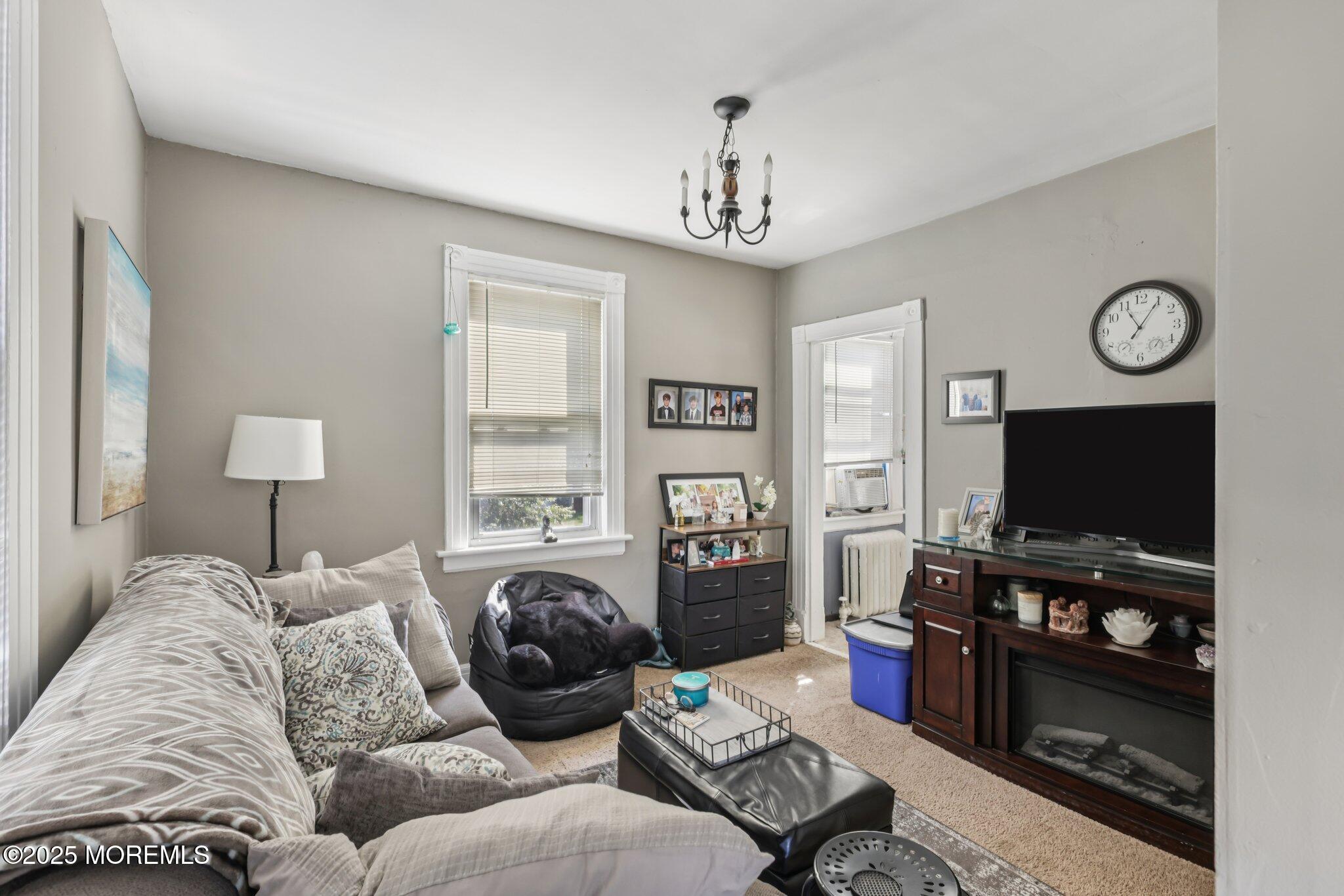 16 Reimer Street Raritan, NJ 08869 - Photo 14 of 30 a living room with furniture a flat screen tv and a window
