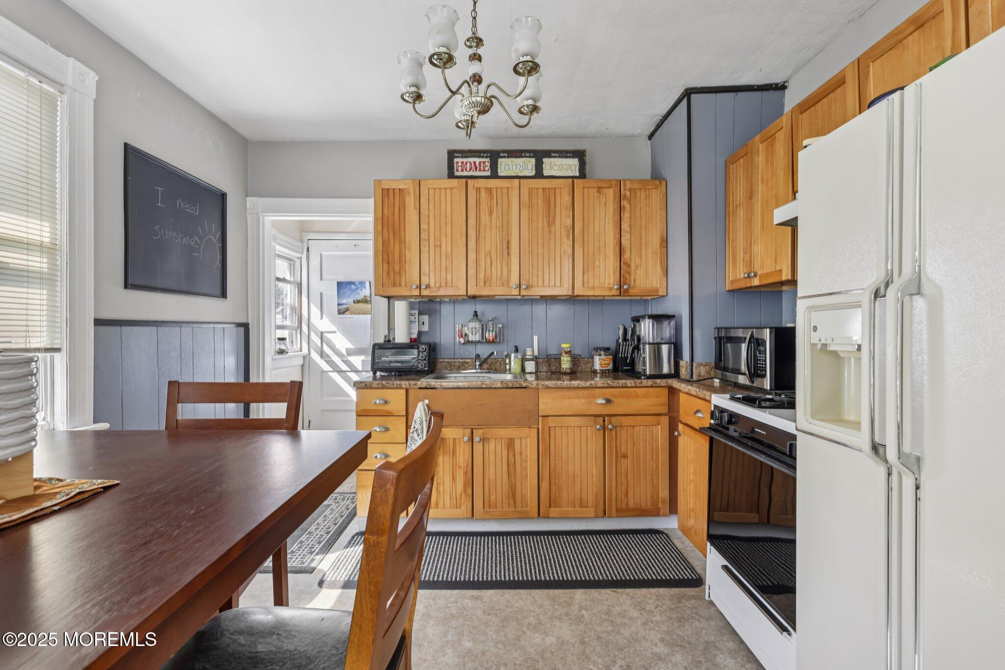 16 Reimer Street Raritan, NJ 08869 - Photo 17 of 30 a kitchen with stainless steel appliances granite countertop a stove a sink and a refrigerator