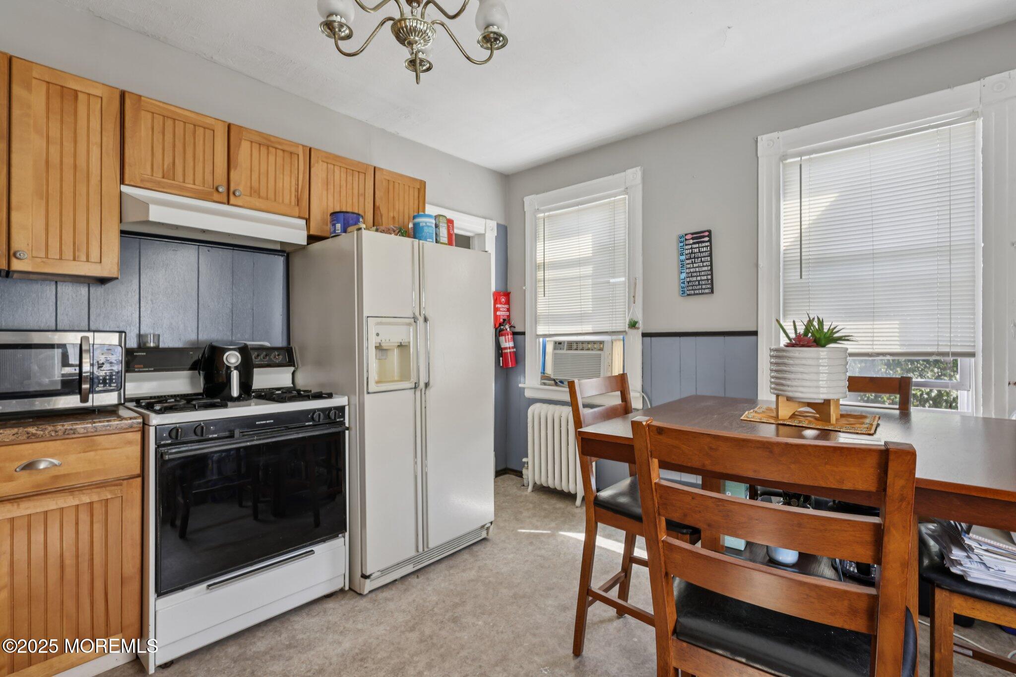 16 Reimer Street Raritan, NJ 08869 - Photo 18 of 30 a kitchen with stainless steel appliances a stove a refrigerator sink and cabinets