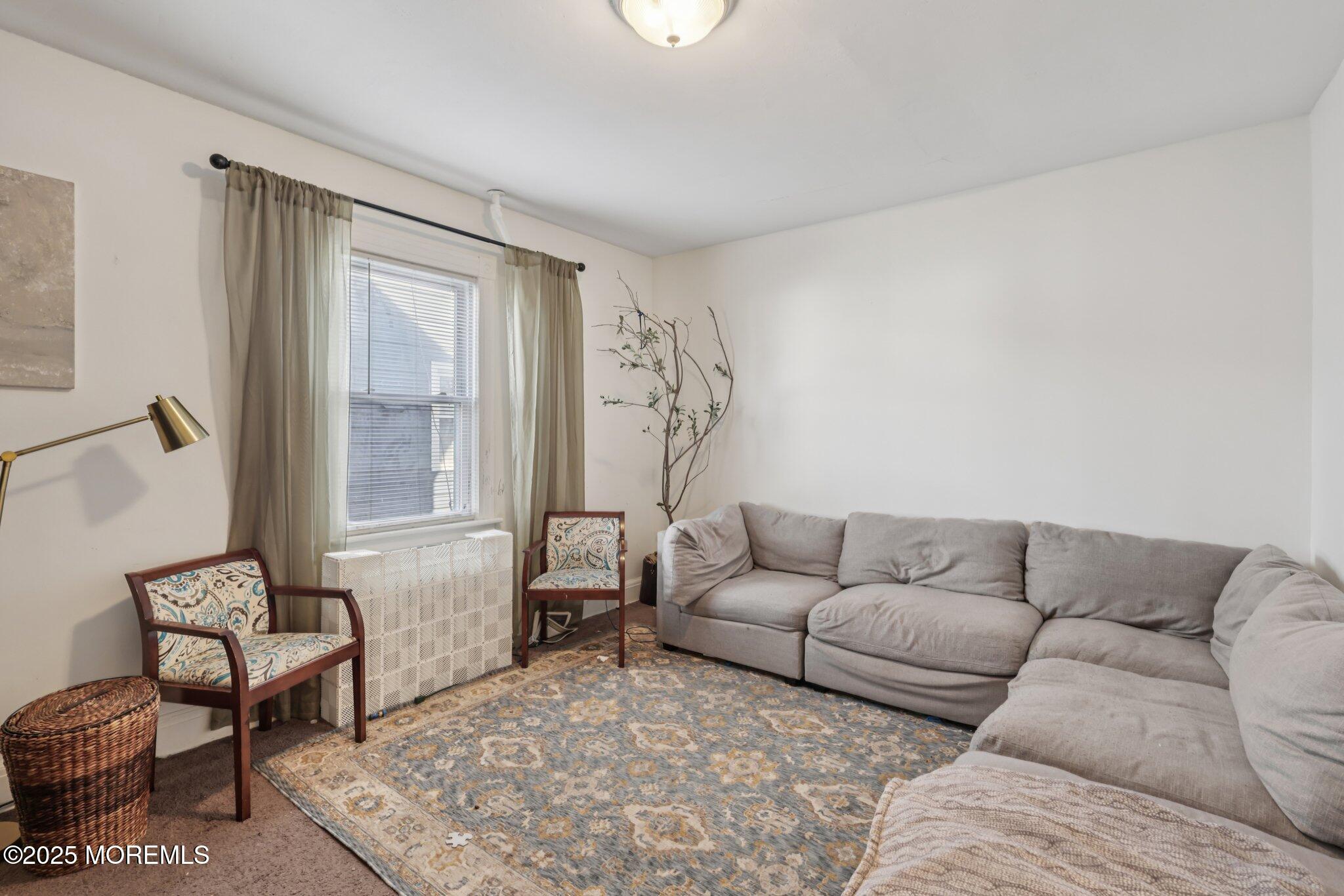 16 Reimer Street Raritan, NJ 08869 - Photo 3 of 30 a living room with furniture and a window