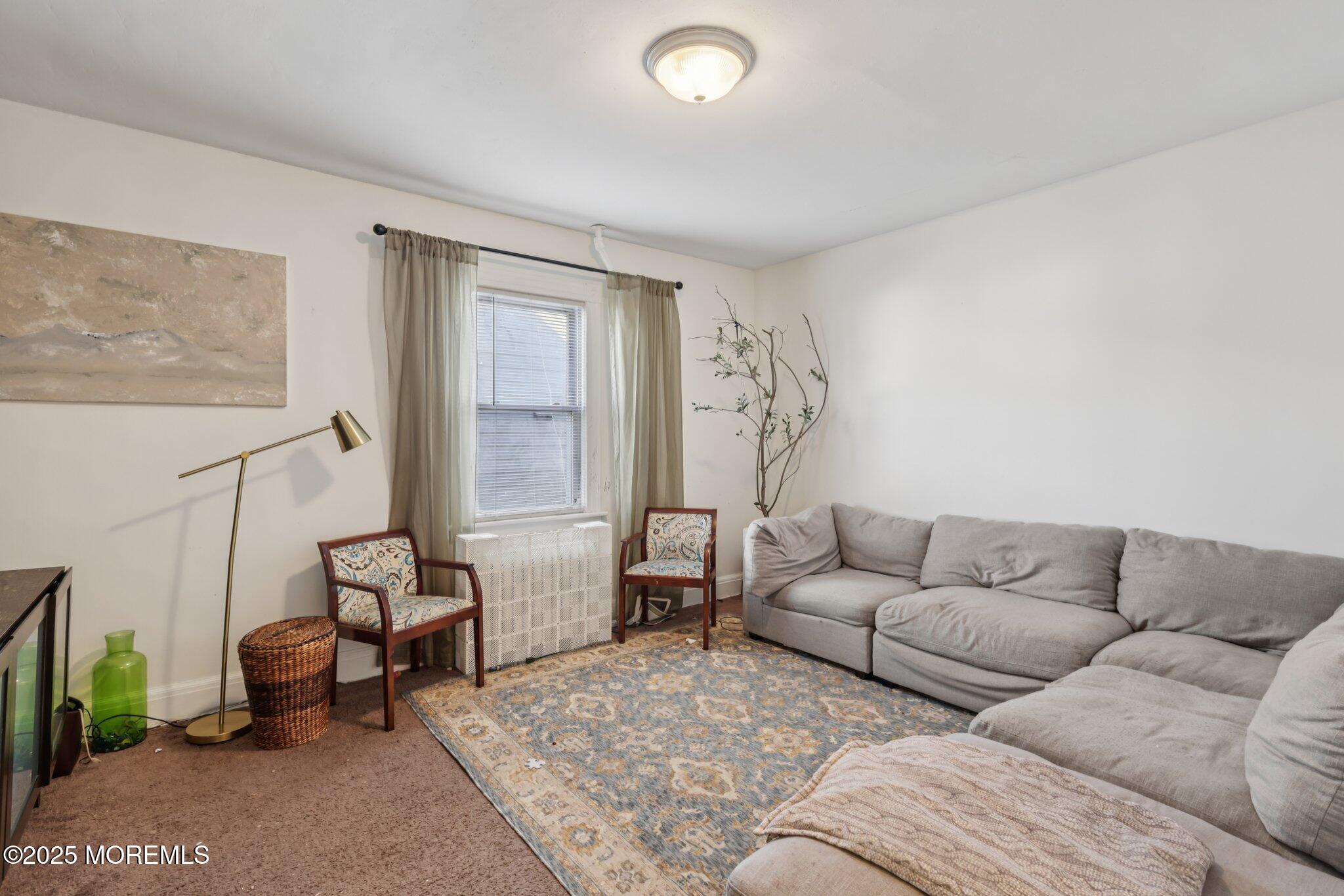 16 Reimer Street Raritan, NJ 08869 - Photo 4 of 30 a living room with furniture and a large window