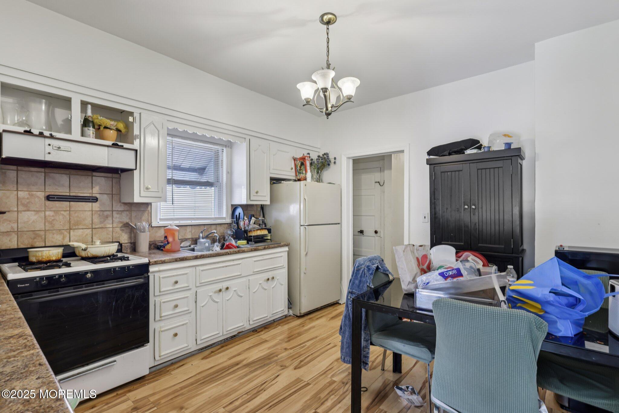 16 Reimer Street Raritan, NJ 08869 - Photo 6 of 30 a kitchen that has a sink cabinets and wooden floor
