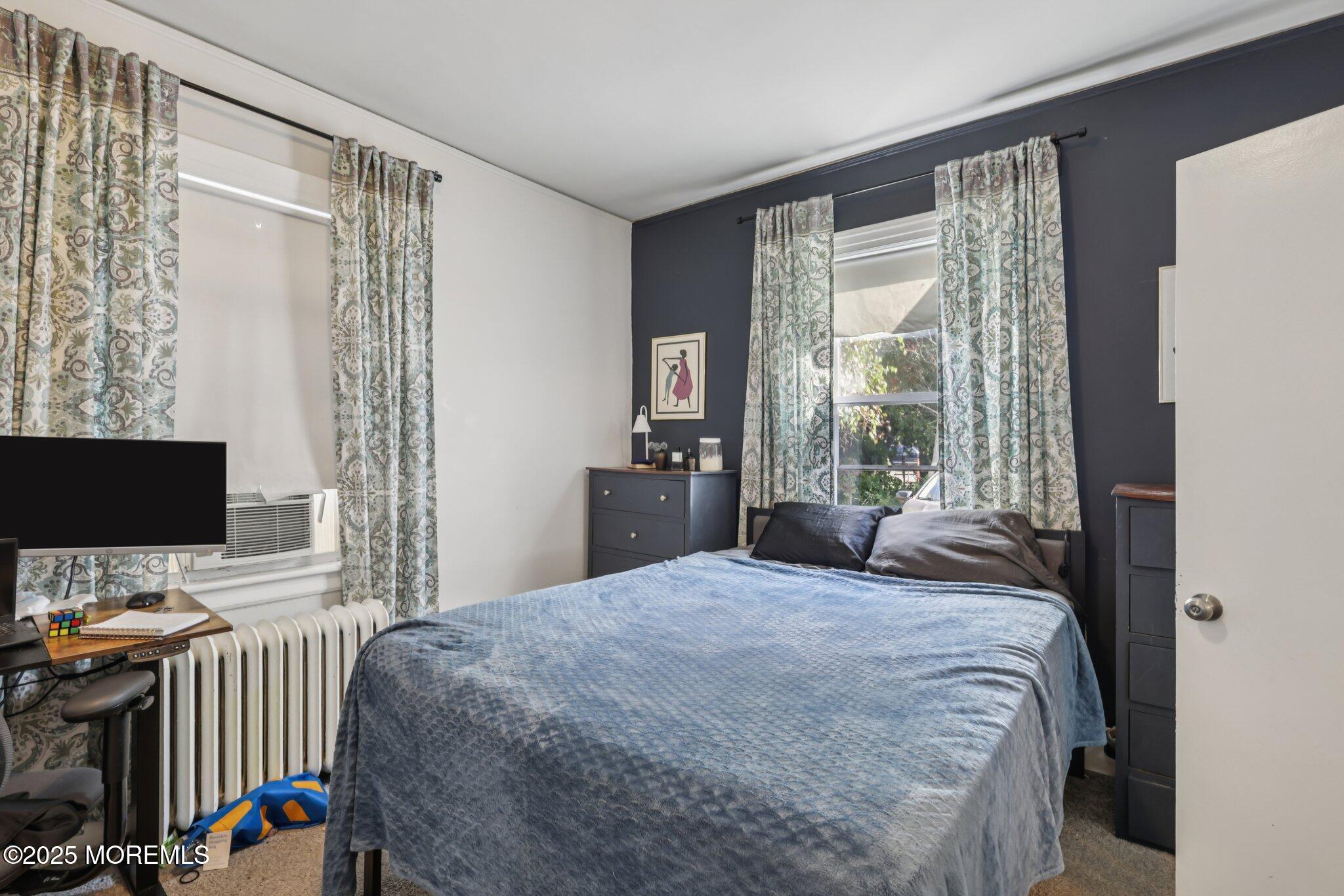 16 Reimer Street Raritan, NJ 08869 - Photo 9 of 30 a bedroom with a bed and a flat screen tv