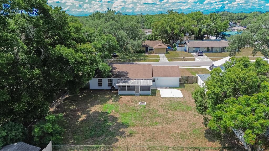 2340 Merrily Circle South Seffner, FL 33584 - Photo 49 of 52 an aerial view of a house with a yard swimming pool outdoor seating and yard