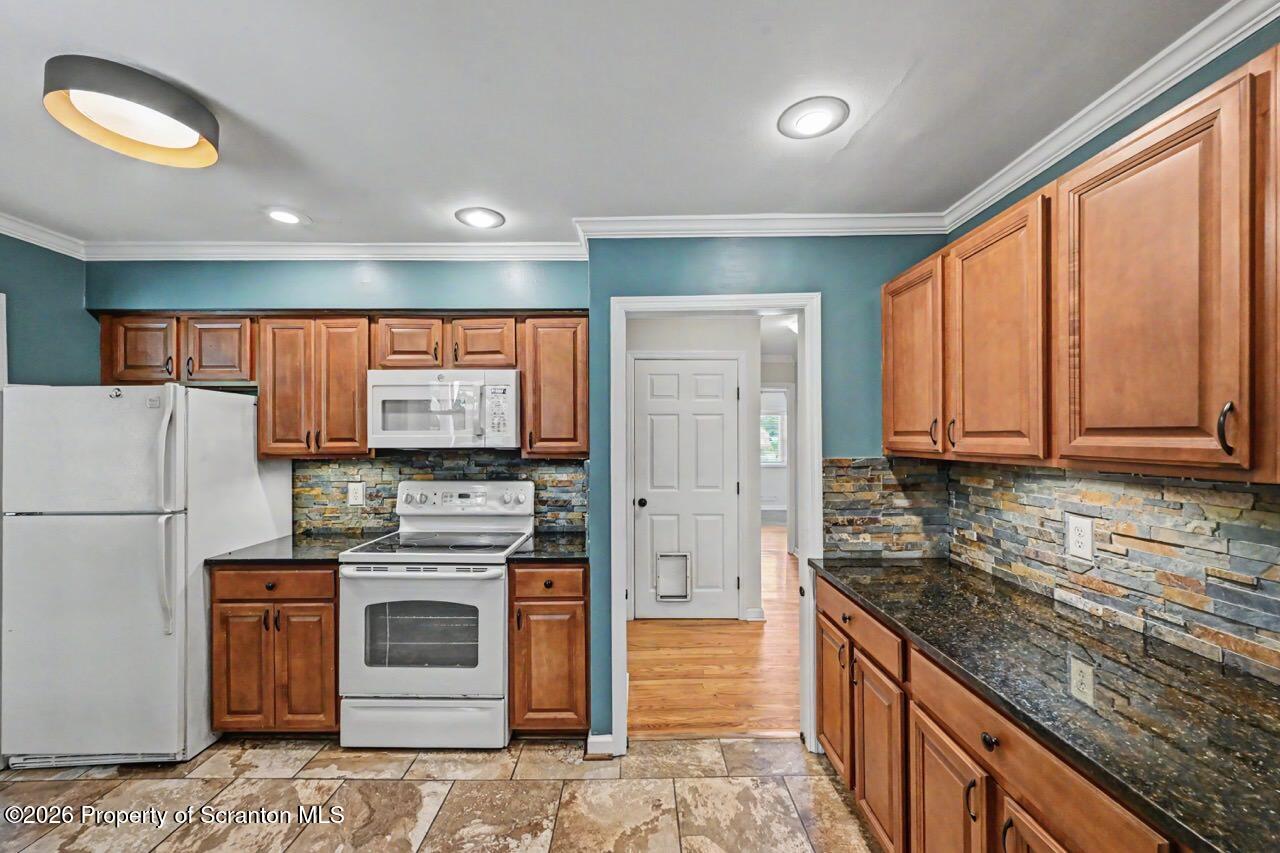 457 Craig Road Dalton, PA 18414 - Photo 35 of 114 a kitchen with kitchen island granite countertop appliances cabinets and a counter space