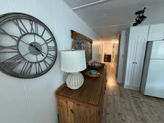 a view of a livingroom with furniture and hardwood floor