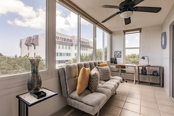 a living room with furniture and a large window