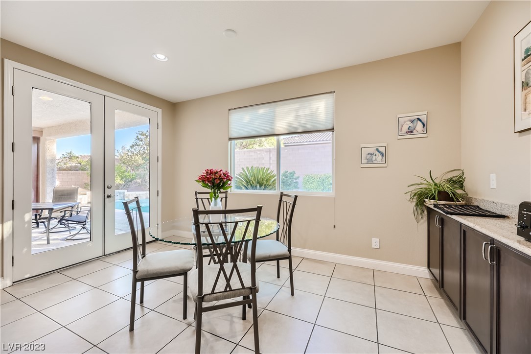 7421 Manse Ranch Avenue Las Vegas, NV 89179 - Photo 12 of 50 French doors connect the dining area with the cove