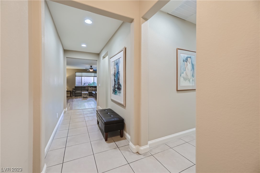7421 Manse Ranch Avenue Las Vegas, NV 89179 - Photo 14 of 50 A gallery entry leads to the great room in the dis