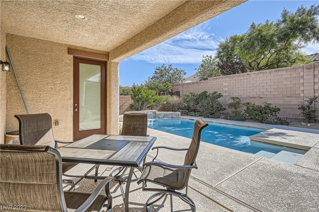 7421 Manse Ranch Avenue Las Vegas, NV 89179 - Photo 37 of 50 The covered patio was upgraded to include electric