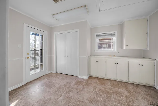 a spacious bathroom with a double vanity sink toilet and a mirror