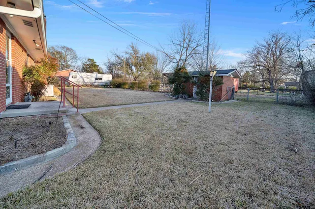 a view of a yard with an trees