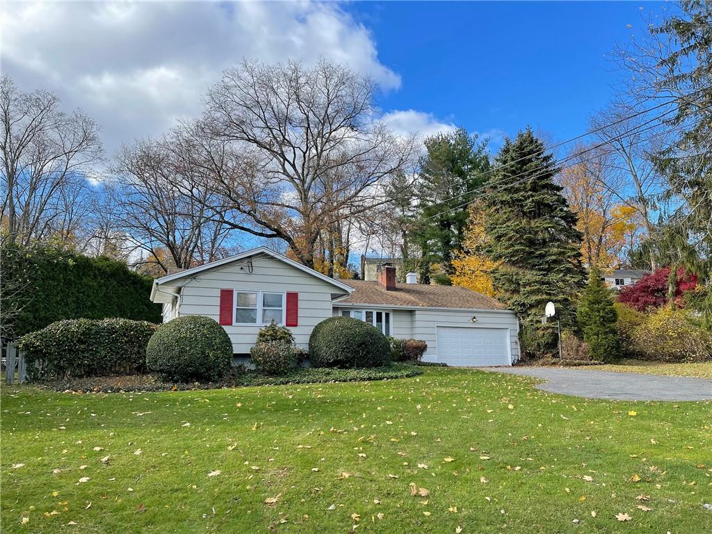 128 North Ridge Street Rye Brook, NY 10573 - Photo 1 of 1 a front view of house with garden