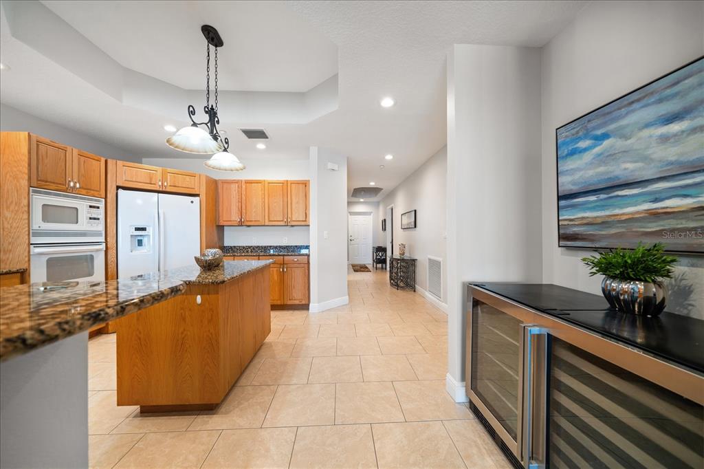 17735 Gulf Boulevard, Unit 304 Redington Shores, FL 33708 - Photo 18 of 66 a large kitchen with kitchen island granite countertop a sink counter space and stainless steel appliances