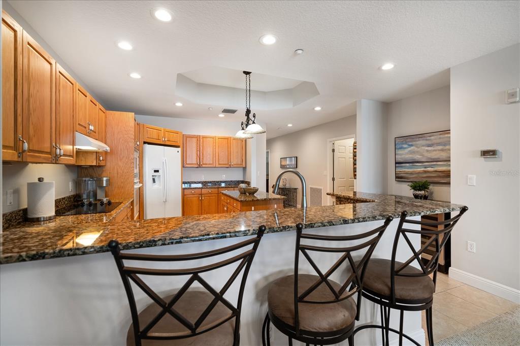 17735 Gulf Boulevard, Unit 304 Redington Shores, FL 33708 - Photo 21 of 66 a dining table & chairs in a kitchen