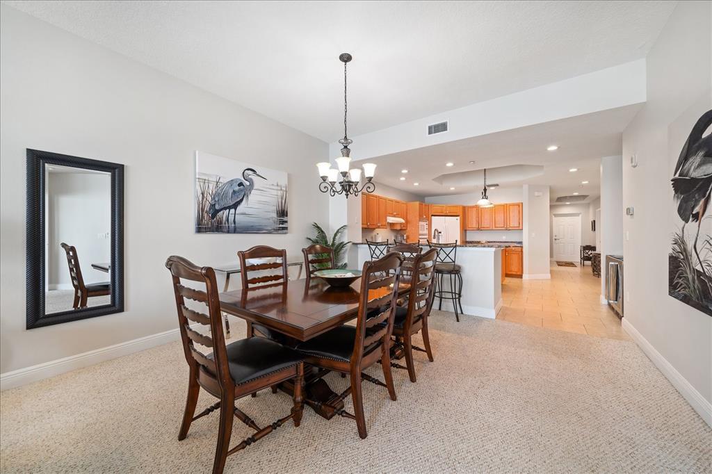 17735 Gulf Boulevard, Unit 304 Redington Shores, FL 33708 - Photo 24 of 66 a dining room with furniture and window
