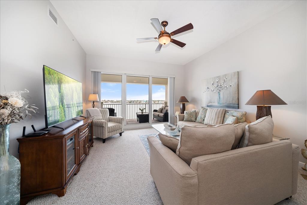 17735 Gulf Boulevard, Unit 304 Redington Shores, FL 33708 - Photo 25 of 66 a living room with furniture and a large window