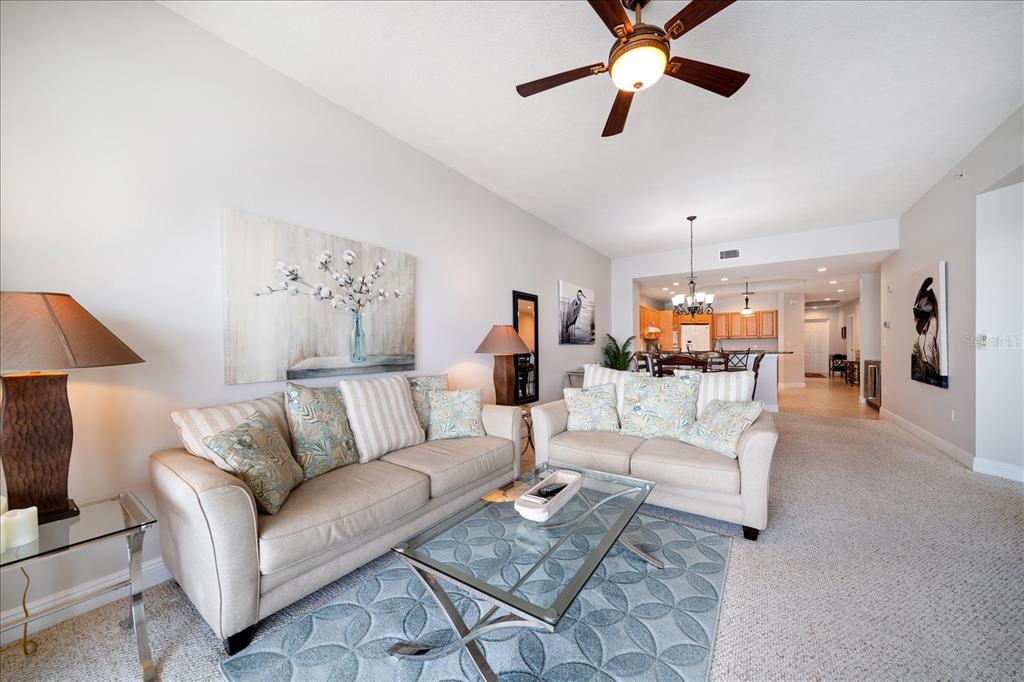 17735 Gulf Boulevard, Unit 304 Redington Shores, FL 33708 - Photo 26 of 66 a living room with furniture and view of kitchen