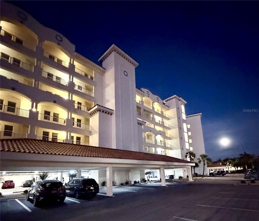 17735 Gulf Boulevard, Unit 304 Redington Shores, FL 33708 - Photo 3 of 66 a view of a building with car parked