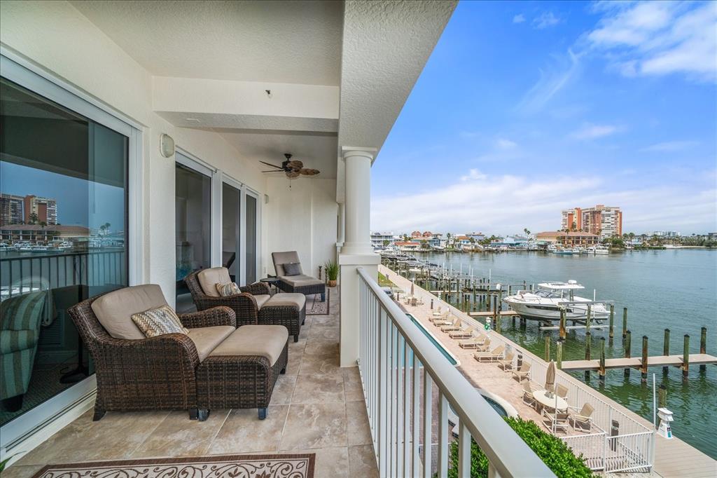 17735 Gulf Boulevard, Unit 304 Redington Shores, FL 33708 - Photo 32 of 66 a balcony with furniture and city view