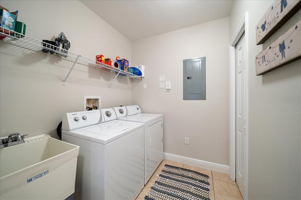 17735 Gulf Boulevard, Unit 304 Redington Shores, FL 33708 - Photo 35 of 66 a utility room with dryer and washer